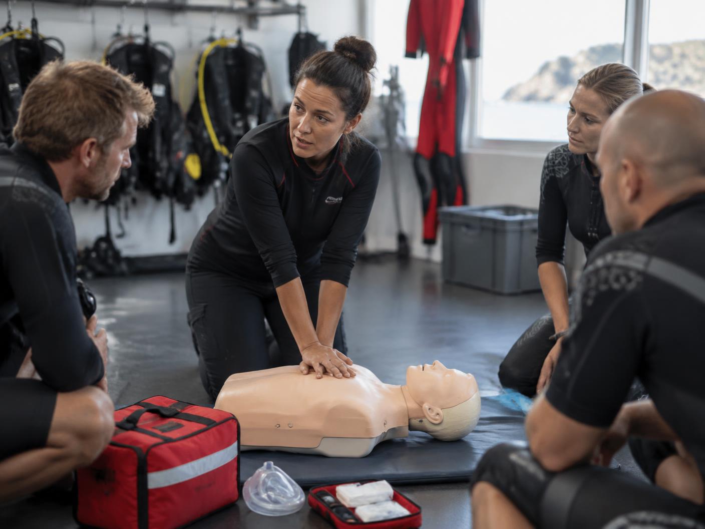 Instructor demonstrating CPR during emergency response training
